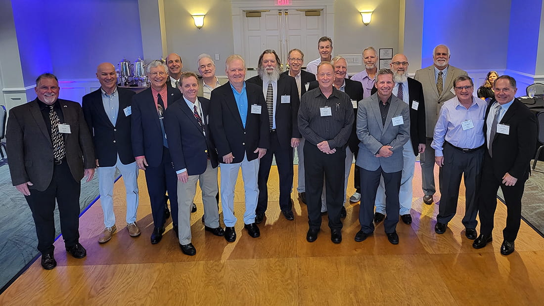 a group of pilots in a hotel ballroom