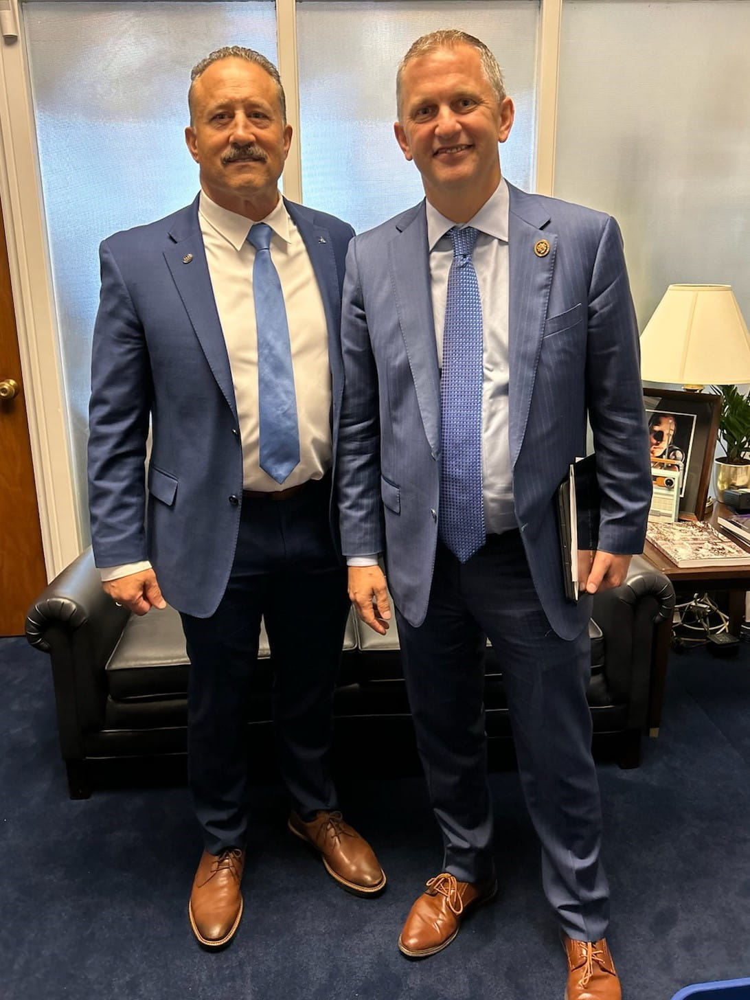 two men in nearly identical outfits