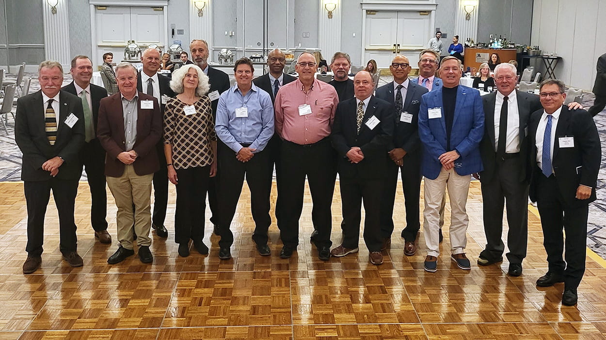 a group of pilots in a hotel ballroom